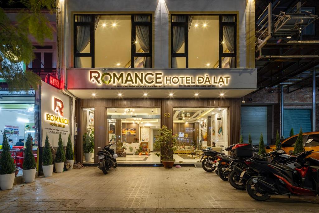 a row of motorcycles parked in front of a store at ROMANCE HOTEL DALAT in Da Lat