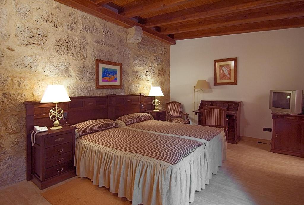 Cama o camas de una habitación en Señorio de Olmillos