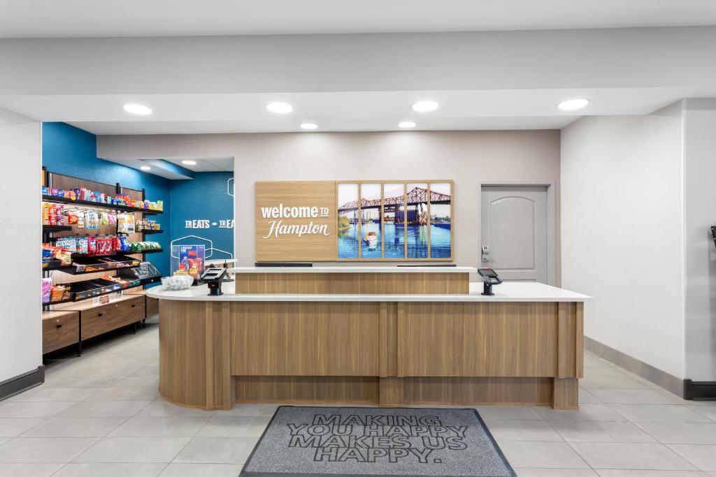 a store lobby with a counter in a pharmacy at Hampton Inn & Suites Chicago Deer Park in Deer Park