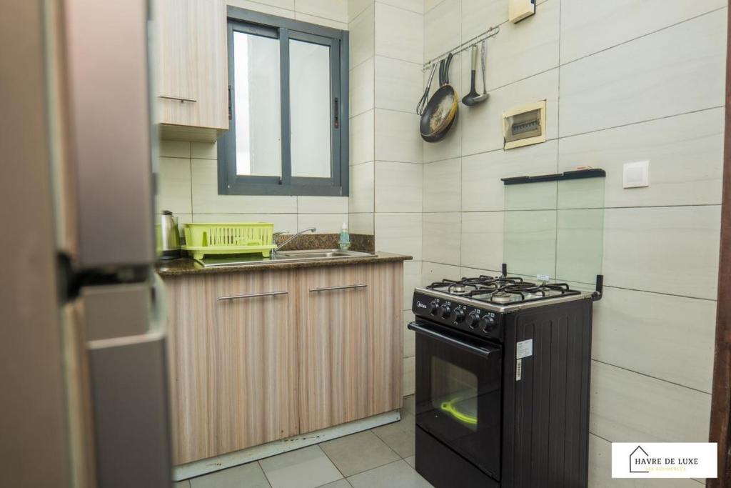 Kuhinja ili čajna kuhinja u objektu Résidence Abidjan