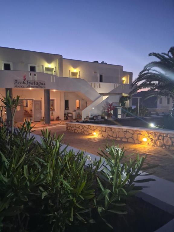 a view of a hotel at night at Archipelagos Apartments in Arkasa