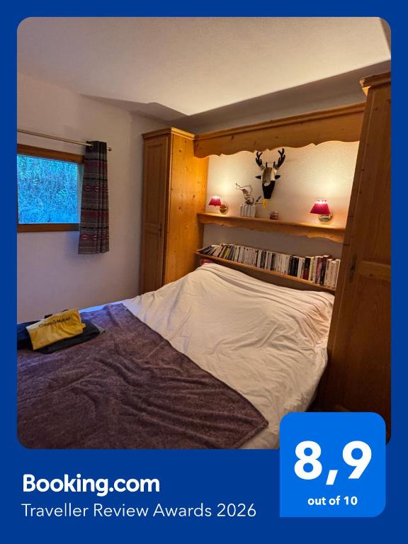 a bedroom with a wooden bunk bed in a room at Les Chalets du Galibier II in Valloire