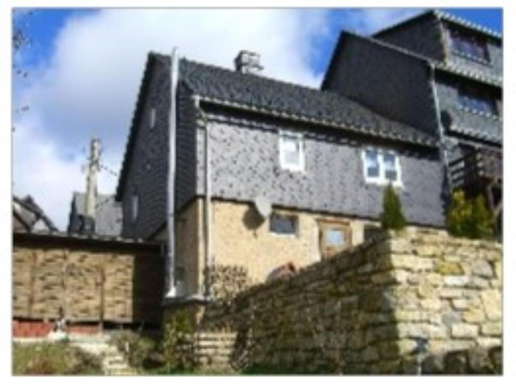 a house on top of a stone wall at Ferienhaus Krabiell in Saalfeld