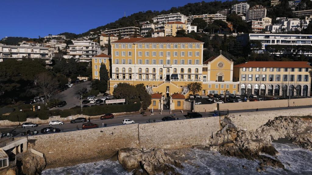 a view of a city with a bridge and buildings at Hotel Le Saint Paul in Nice