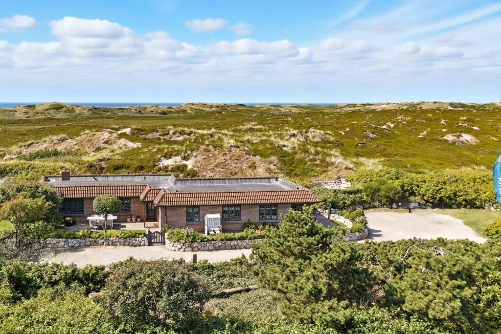 an aerial view of a house in a field at Beach Bungalow Sylt 2 in Dikjendeel