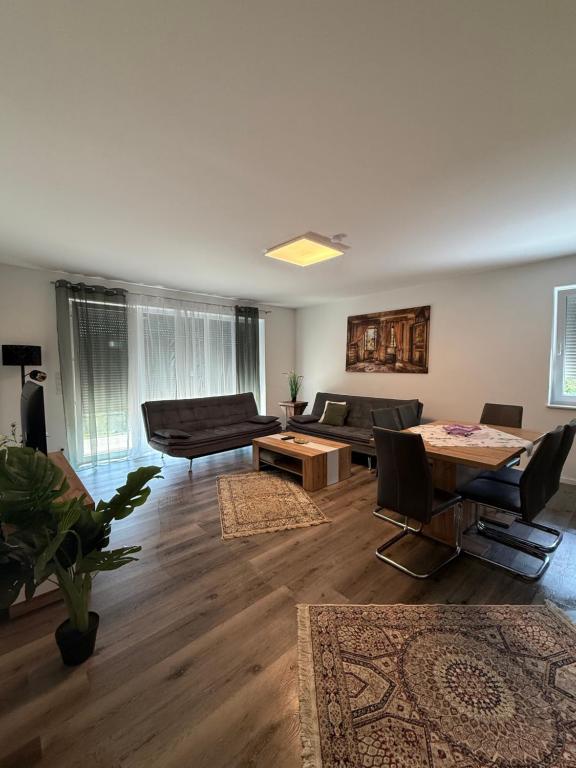 a living room with a couch and a table at Sorinas Home - Comfortable Apartment near Graz - Free Parking in Wagersbach