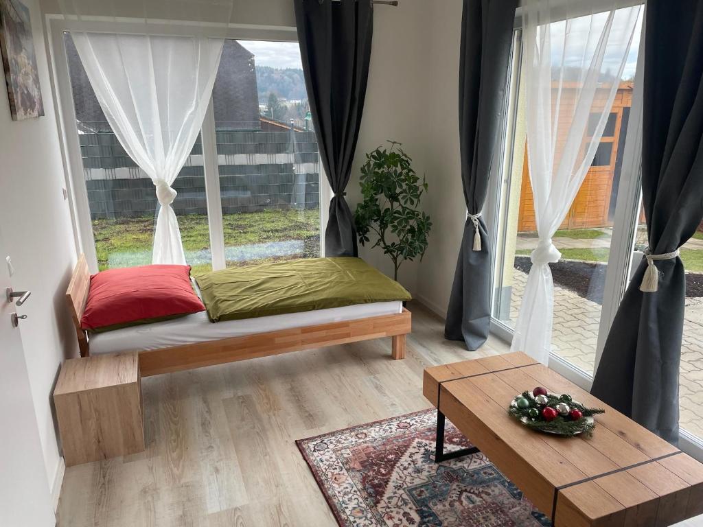 a room with a bed and a large window at Sorinas Home - Comfortable Apartment near Graz - Free Parking in Wagersbach