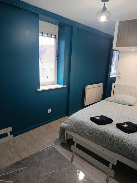 Llit o llits en una habitació de Studio des Capucins 2