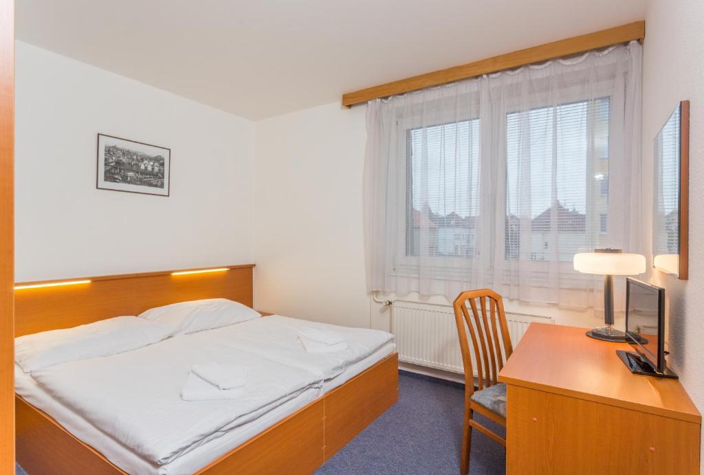 Postel nebo postele na pokoji v ubytování Hotel Astra