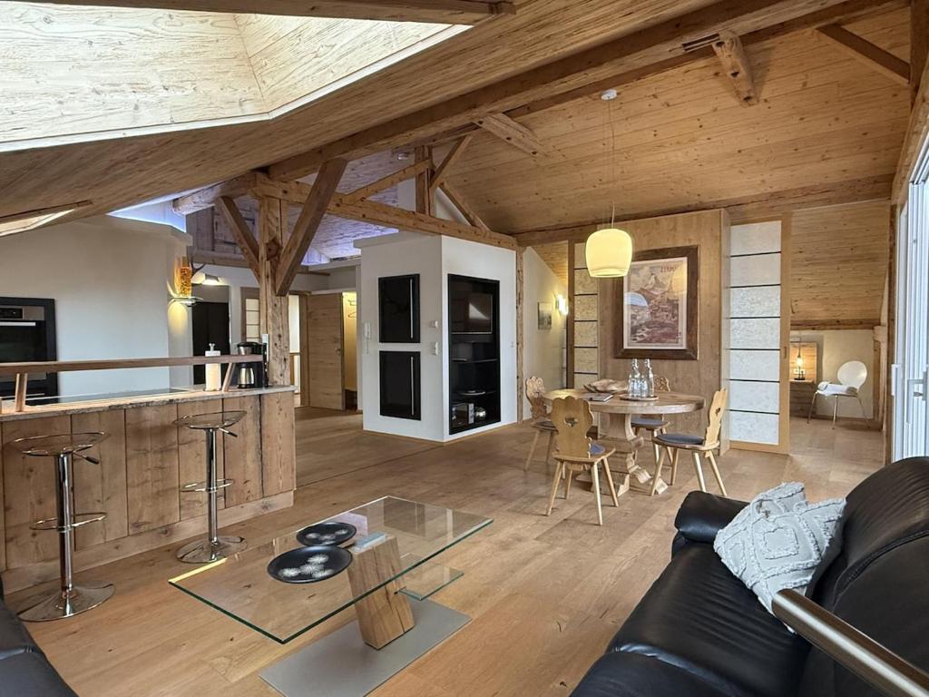 a living room with a couch and a table at Ferienwohnung Haus Bader in Garmisch-Partenkirchen