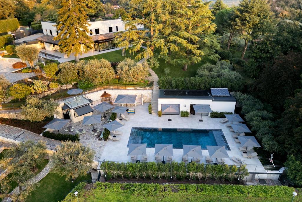 an aerial view of a mansion with a swimming pool at Villa Bocchi by Geco Vacation Rentals in Negrar