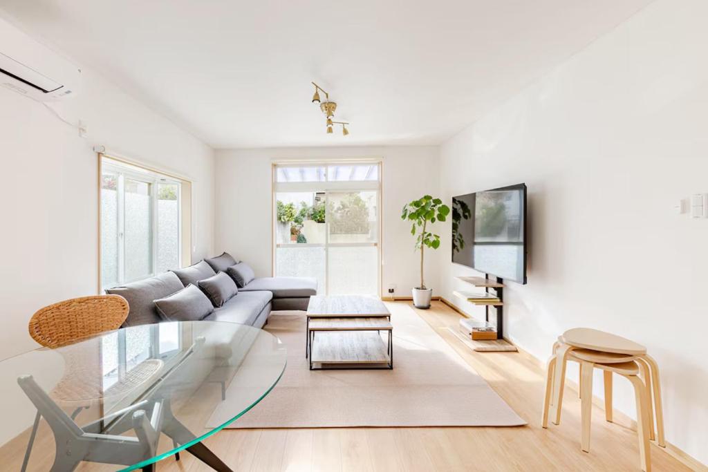 a living room with a couch and a glass table at Itoshima Private Villa 4LDK 4-Bedroom in Itoshima