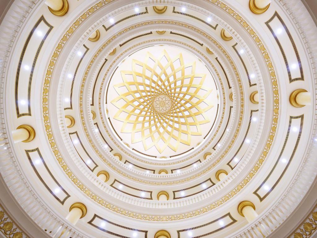 a ceiling of a building with a gold design at Kempinski Hotel Palm Jumeirah in Dubai