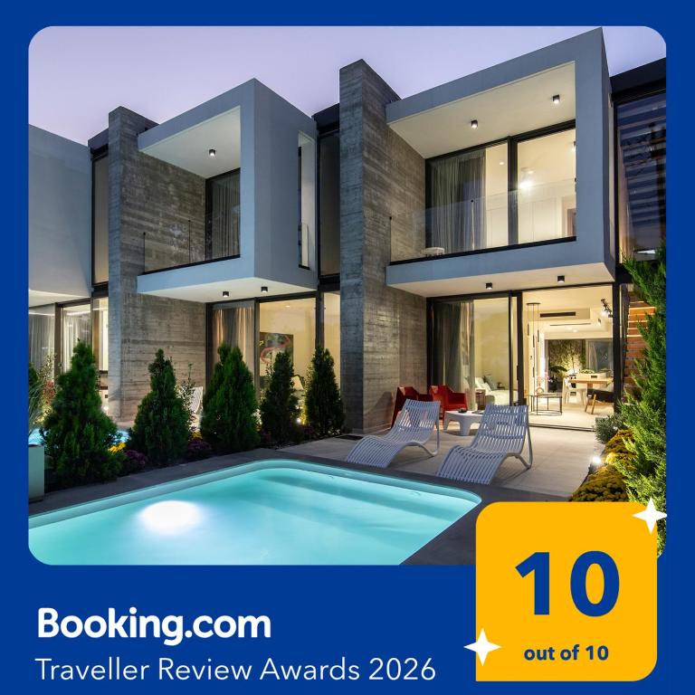 a house with a swimming pool in front of it at IKIES 3 Modern Eco-Friendly Private Seaview SIGNATURE Villas with a Pool in Volos