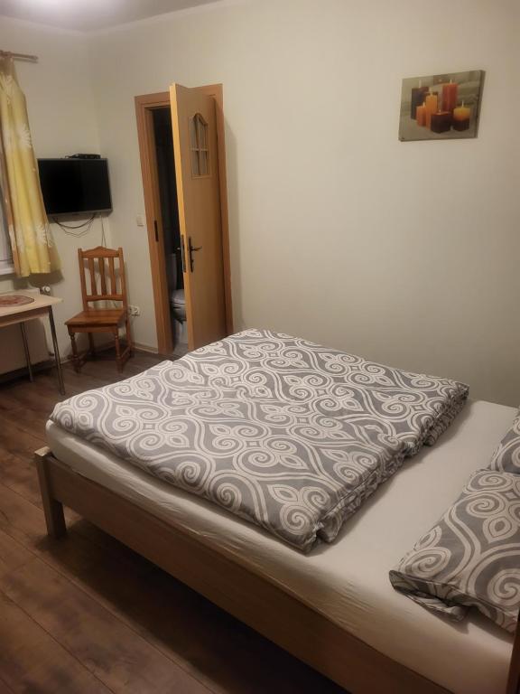 a bed in a room with at Tyrolczyk in Szklarska Poręba