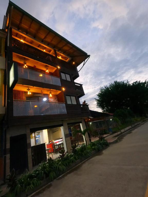 a building with lights on the side of it at Petra Hotel in Nuquí