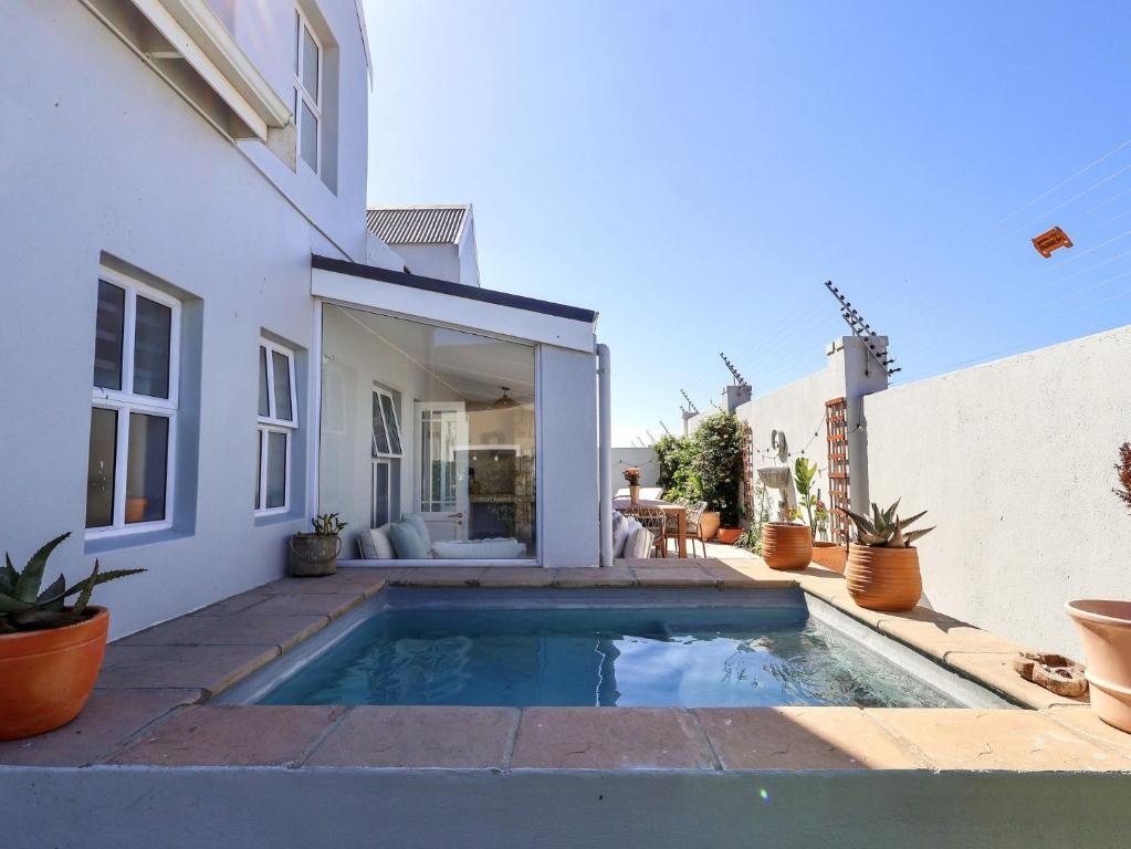 a swimming pool in the backyard of a house at Salt & Butter in Hermanus