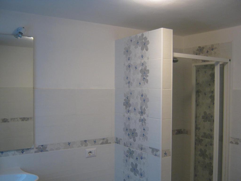 a bathroom with a shower and a sink at La Casetta DI Luciano in Foligno