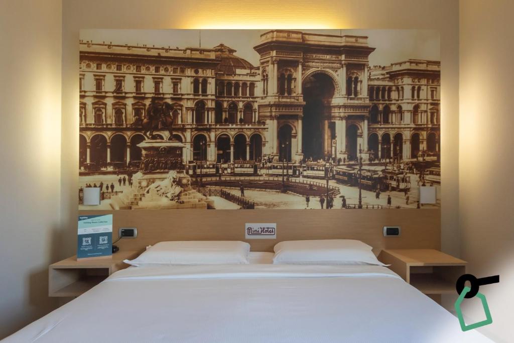 a bedroom with a bed with a picture of a building at Hotiday Milano Navigli in Milan