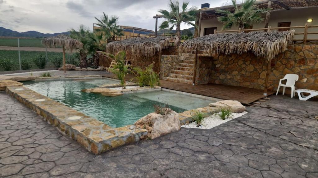 a house with a swimming pool in the yard at Villa Loma de Bas 1 y 2 in Águilas