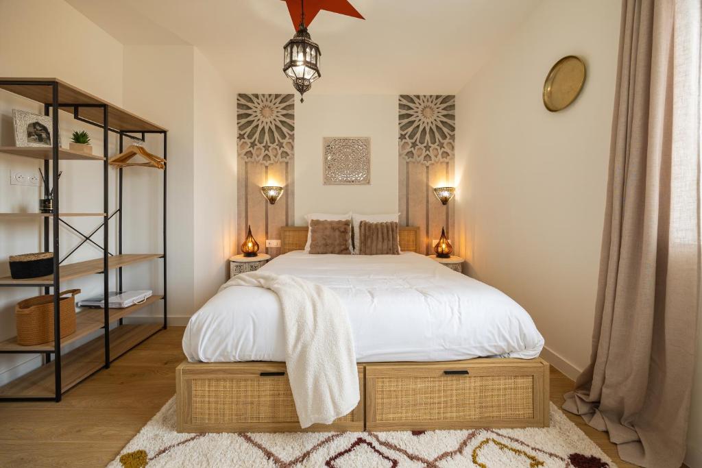 a bedroom with a large bed and a mirror at 304 Chanzy - T1 Spacieux - Gare & Centre - Wifi in Le Mans
