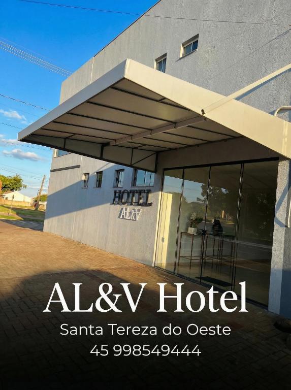 a building with a sign that reads alvy hotel at AL&V Hotel in Santa Tereza do Oeste