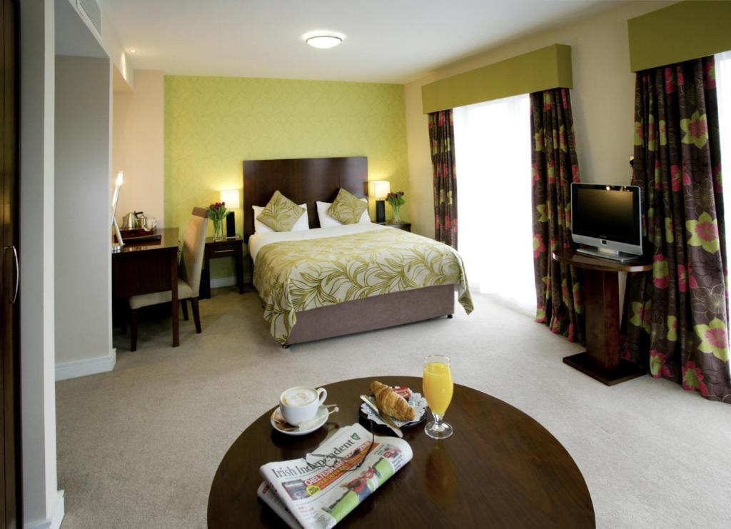 Postel nebo postele na pokoji v ubytování George Limerick Hotel