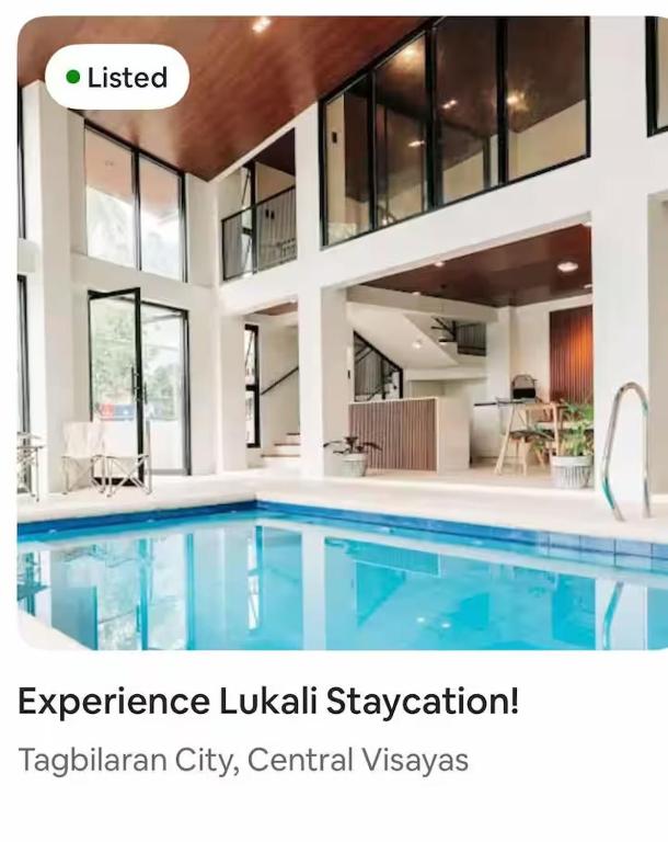 a large swimming pool in a house at Lukali Staycation in Tagbilaran City