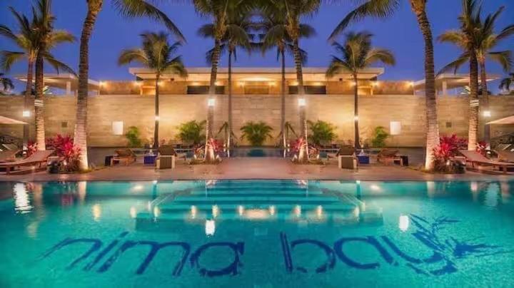 a large swimming pool in front of a hotel at Nima bay in Puerto Vallarta