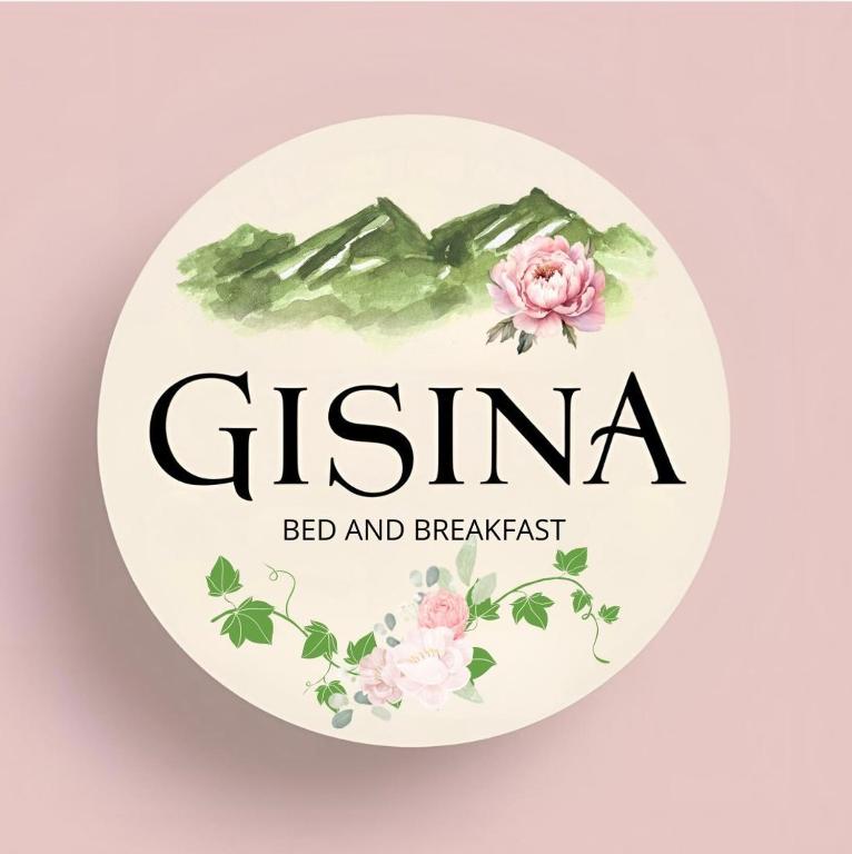 a sign for a bed and breakfast with flowers at La Gisina B&B in Gaglianico