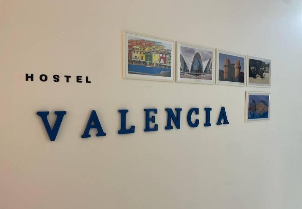 a sign for a museum with pictures on a wall at Hostel valencia ruzafa in Valencia