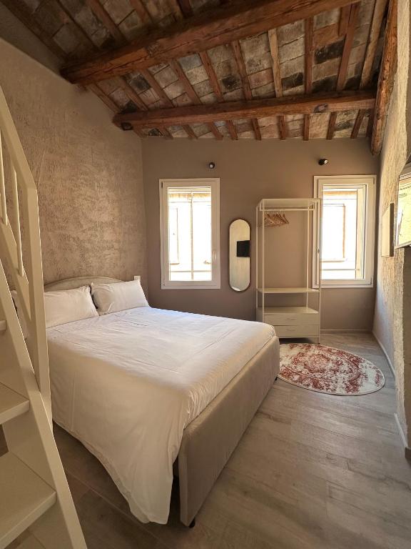Llit o llits en una habitació de Casa Uberti