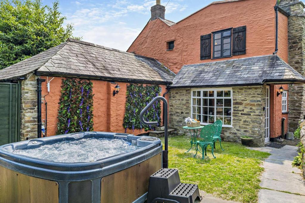 a hot tub in the yard of a house at 1 Bed in Duloe oc-b29367 in Duloe
