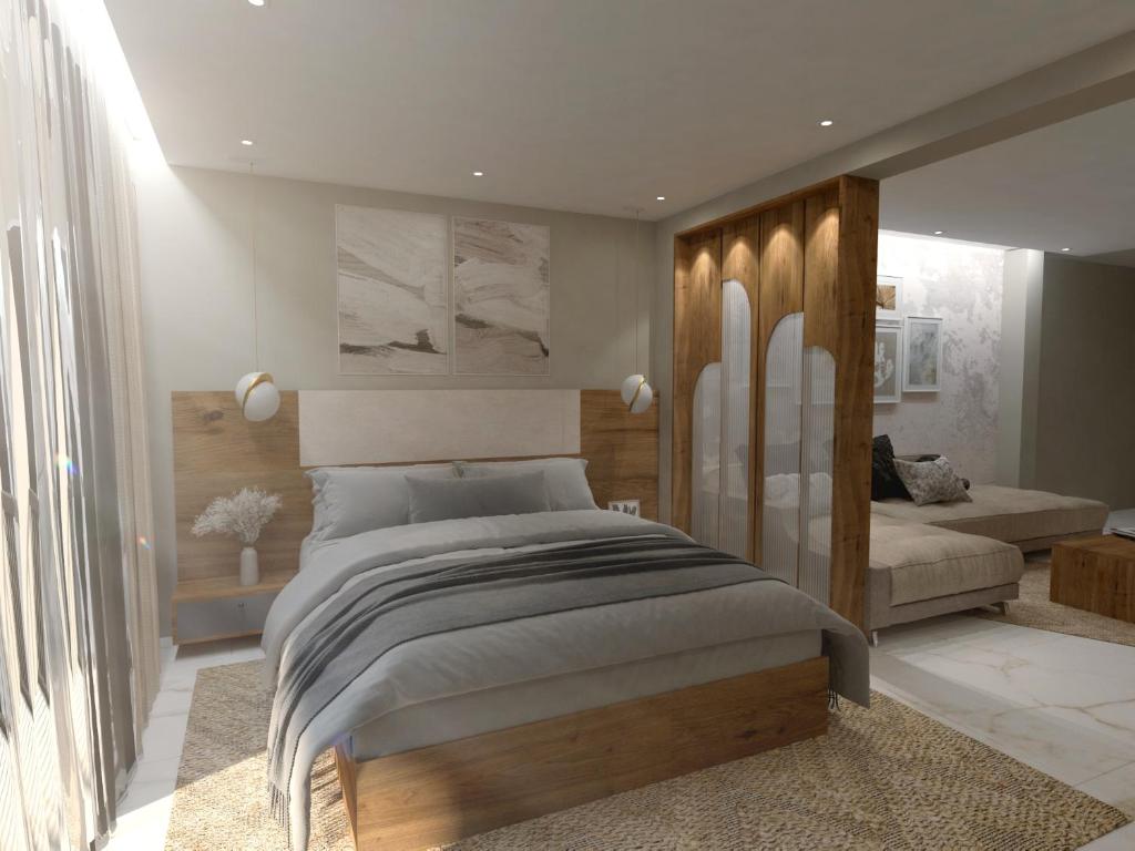 a bedroom with a large bed and a couch at Elara Residency Cheravathur in Cheruvattūr