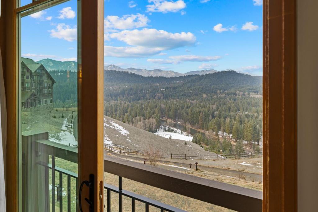 a view from a window of a mountain view at 3033 Suncadia Riverfront Studio Lodge Pool Access in Cle Elum