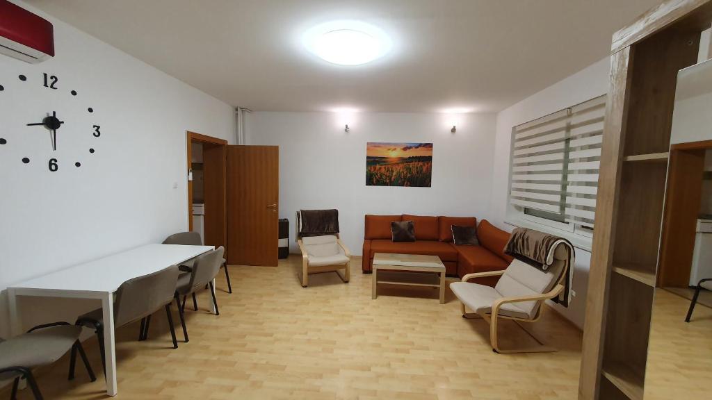 a living room with a couch and a table at Happy Corner in Varaždin