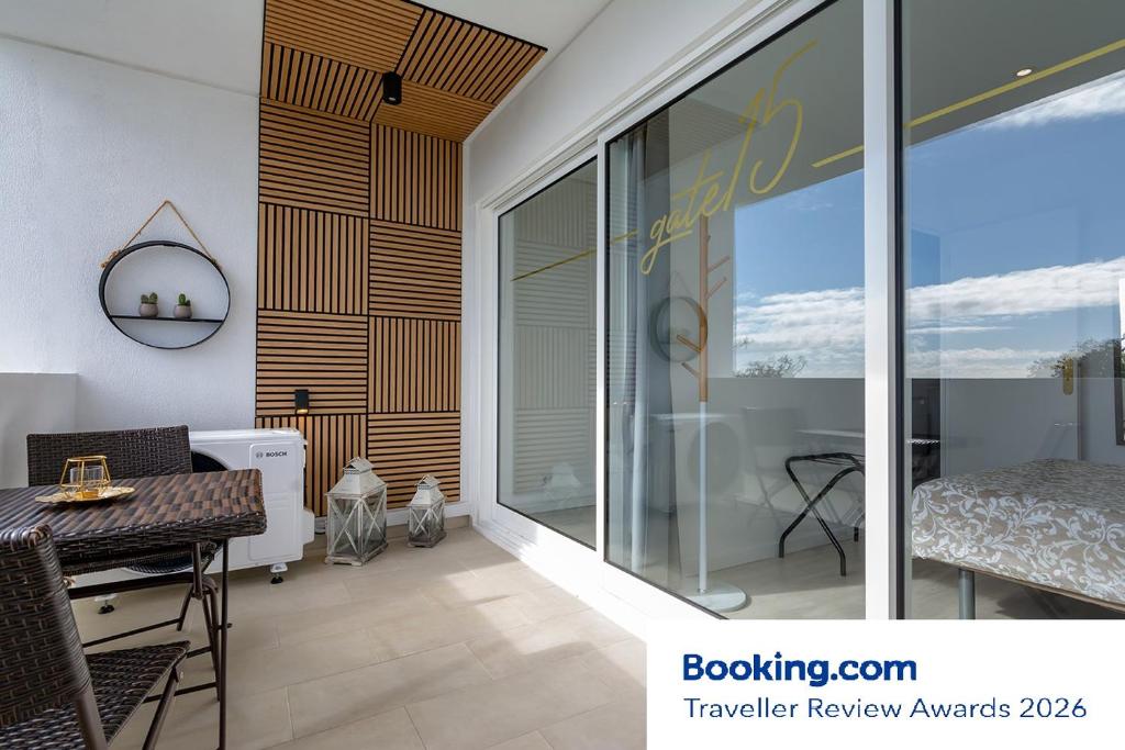 a dining room with a table and a window at gate15 in Machico