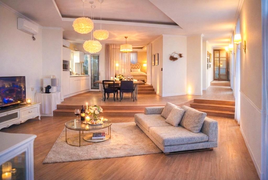 a living room with a couch and a table at Jeju Semo, Byeol in Seogwipo