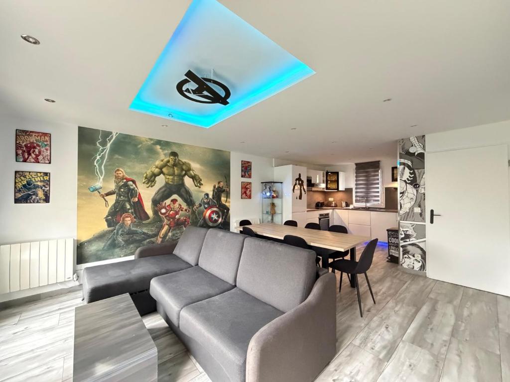 a living room with a couch and a table at Disney Avengers House in Magny-le-Hongre