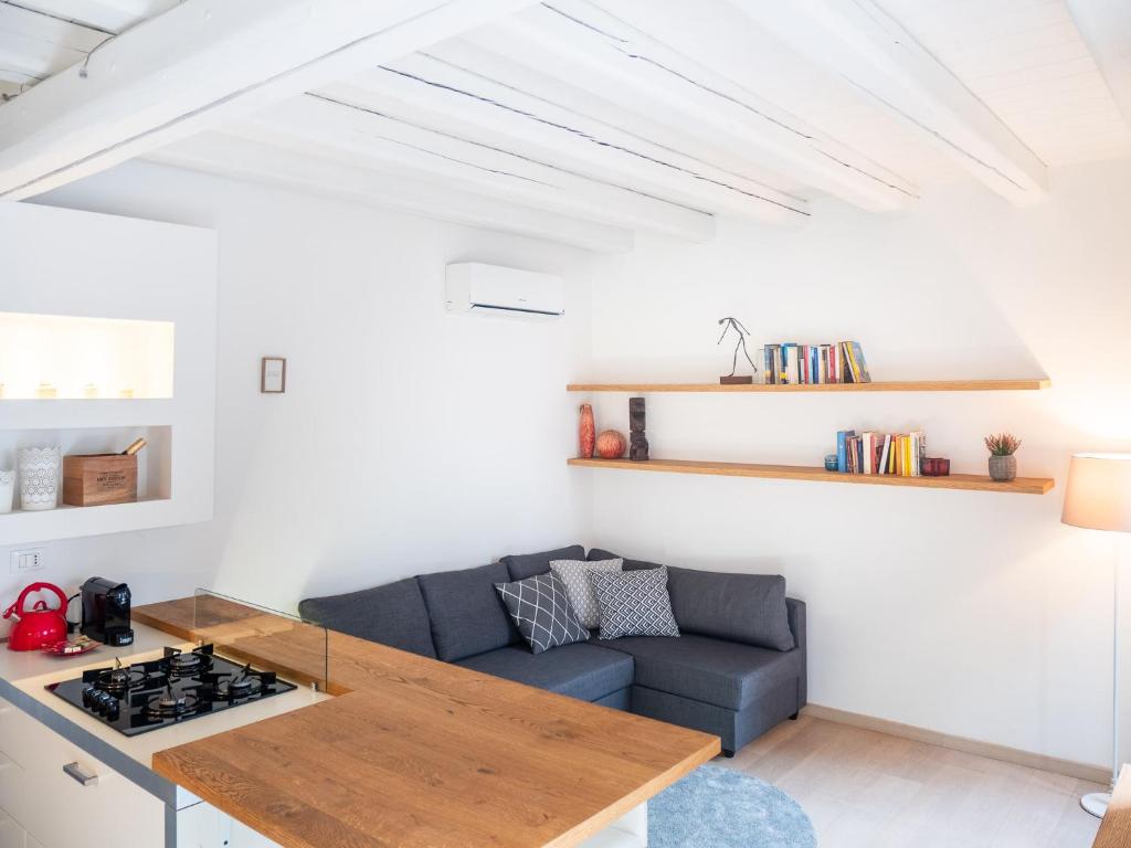 a living room with a couch and a table at Venice Entry Comfort Apartment in Mestre