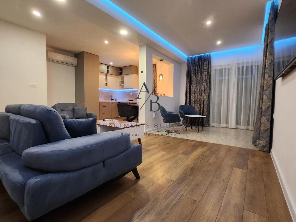 a living room with a couch and a table at Apartments Bulatovic in Budva