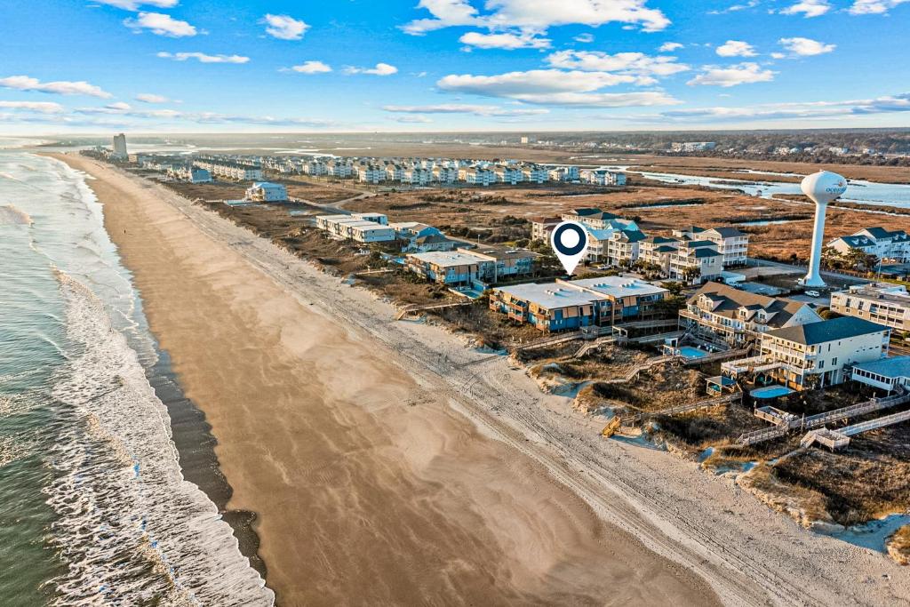 an aerial view of a beach with houses and the ocean at OIB34 OIB Isle Retreat in Ocean Isle Beach