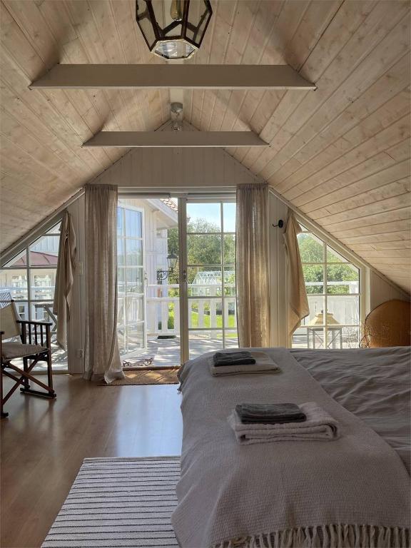 a bedroom with a bed with two towels on it at Apartment at Prästtorp in Brastad