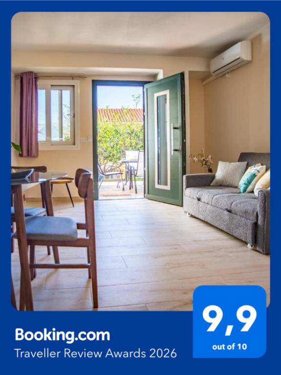 a living room with a couch and a table at Casa Giardino in Argostoli