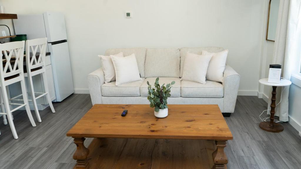 a living room with a couch and a coffee table at Peace Barn Getaway in Carrollton