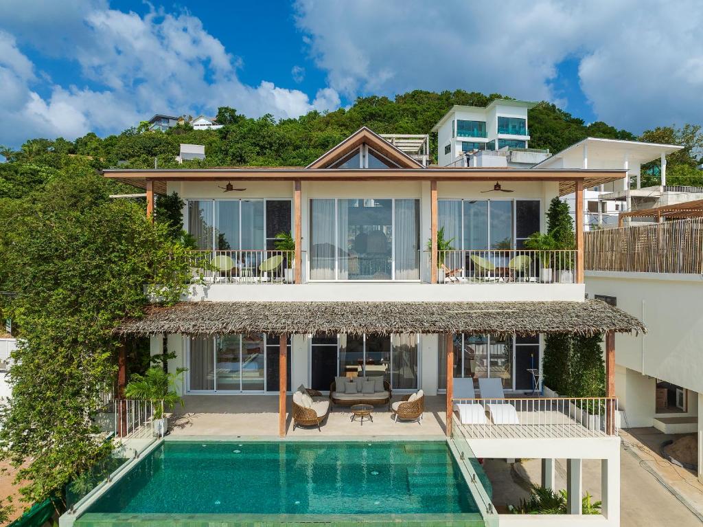 an aerial view of a house with a swimming pool at Villa Vista, 5BR Beach Front SeaView Haven, Steps to Sand in Haad Pleayleam
