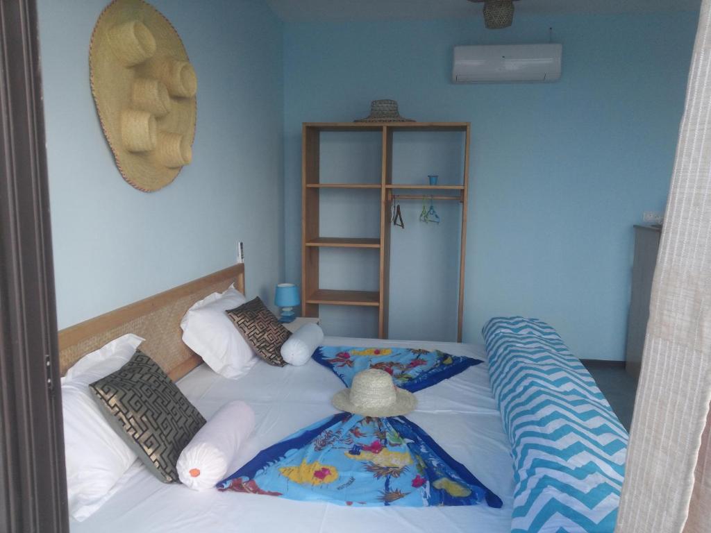 Postel nebo postele na pokoji v ubytování Le Pandanus