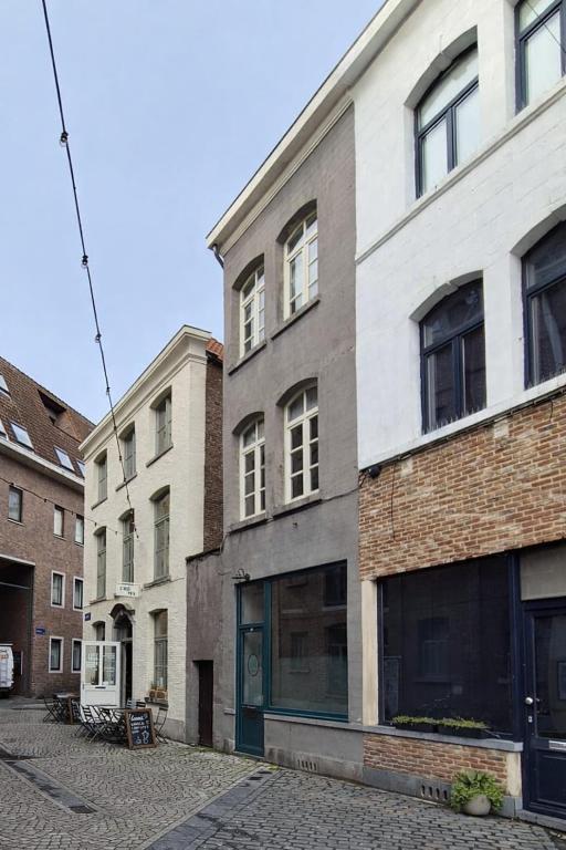 a building on the side of a street at Alcazar in Mechelen