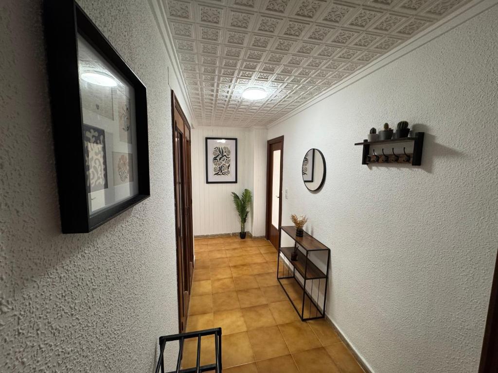 a hallway with white walls and a ceiling at Albalat Centro in Albalat de la Ribera