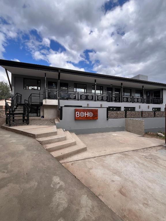 a building with a bota sign on the side of it at Boho Suites in Tafí del Valle